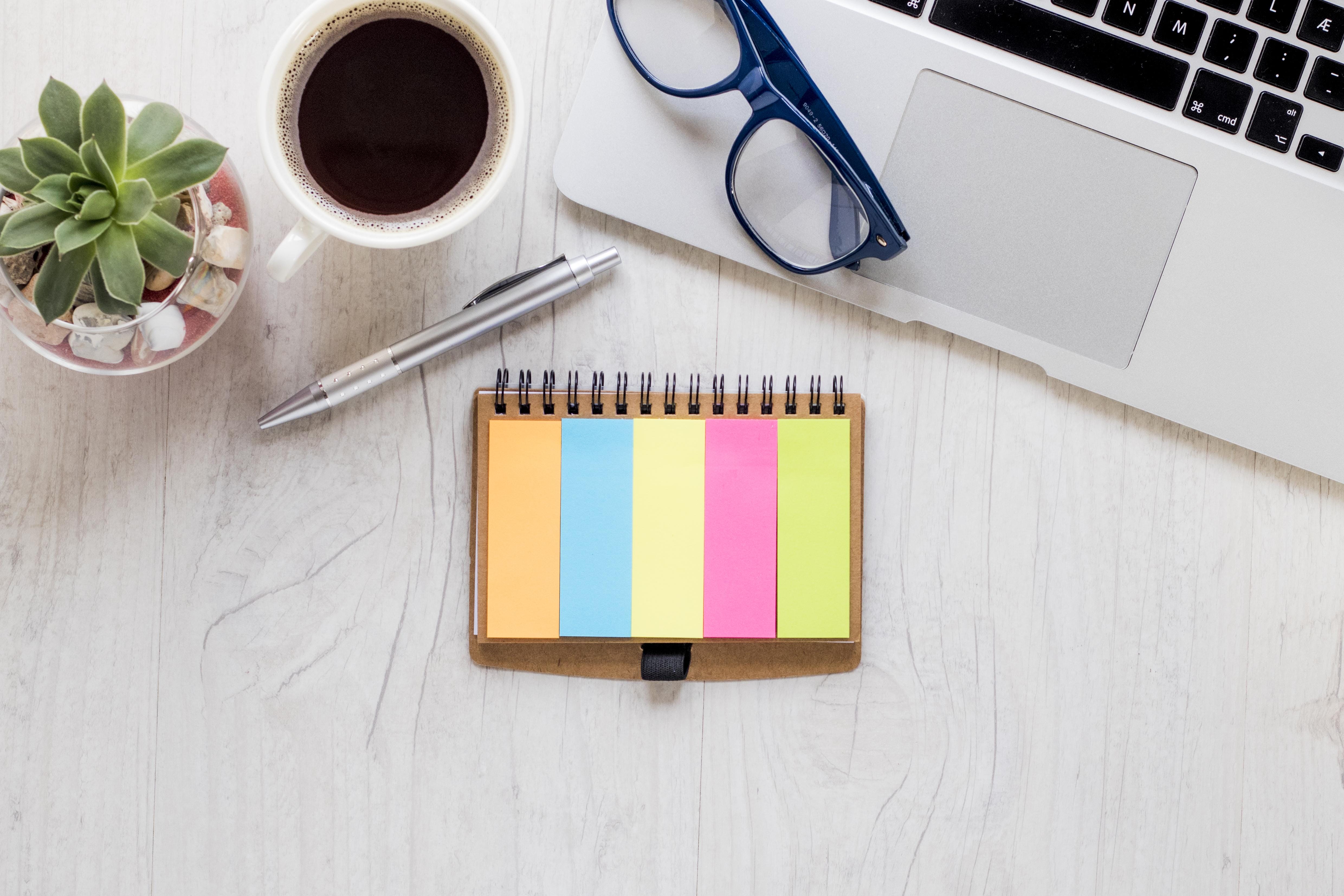 A person focused intensely on their work at a beautifully designed desk, highlighting the positive impact of an optimized workspace on concentration and output.